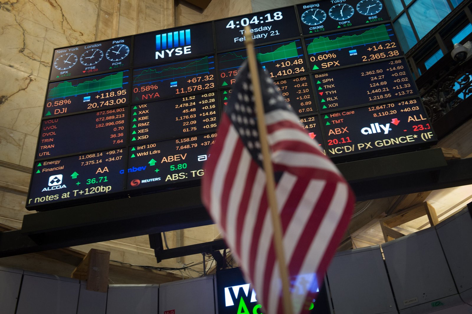 a flag in front of a digital board